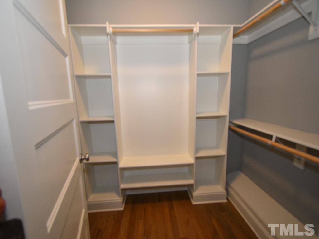 607 Morreene Road Durham, NC 27705 - Photo 29 of 48 a view of walk in closet with empty racks