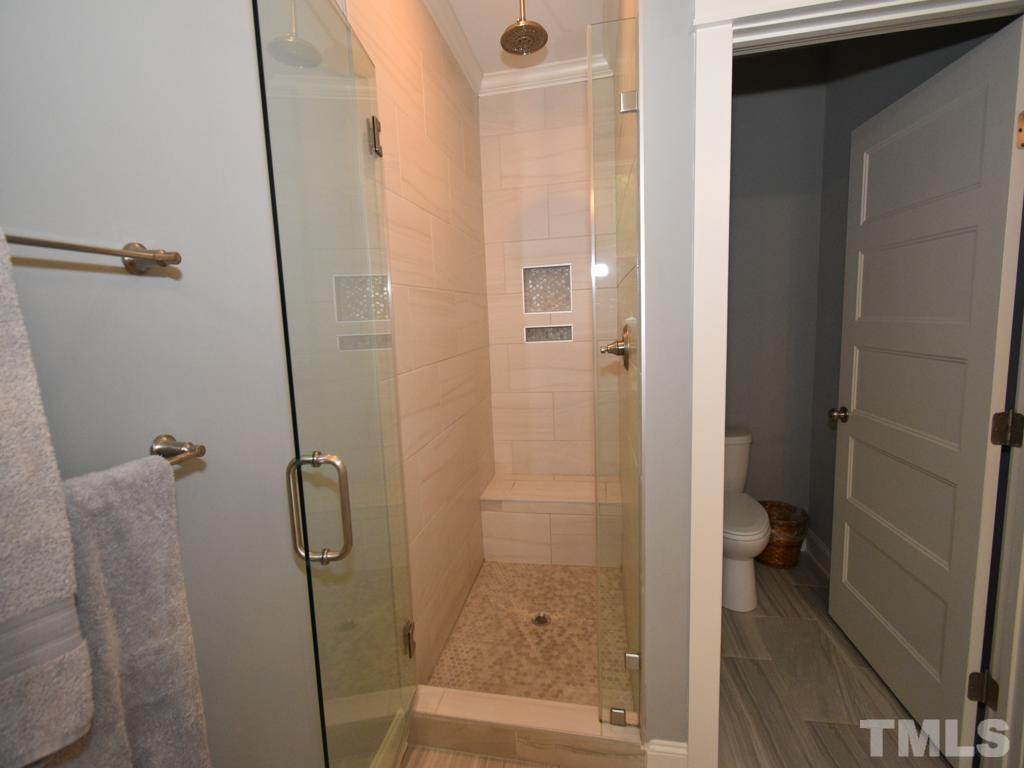 607 Morreene Road Durham, NC 27705 - Photo 35 of 48 a bathroom with a granite countertop shower
