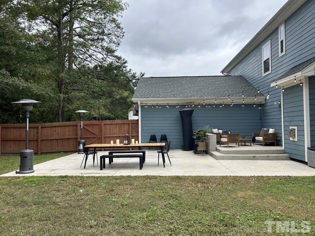 607 Morreene Road Durham, NC 27705 - Photo 45 of 48 a view of a house with patio and a yard