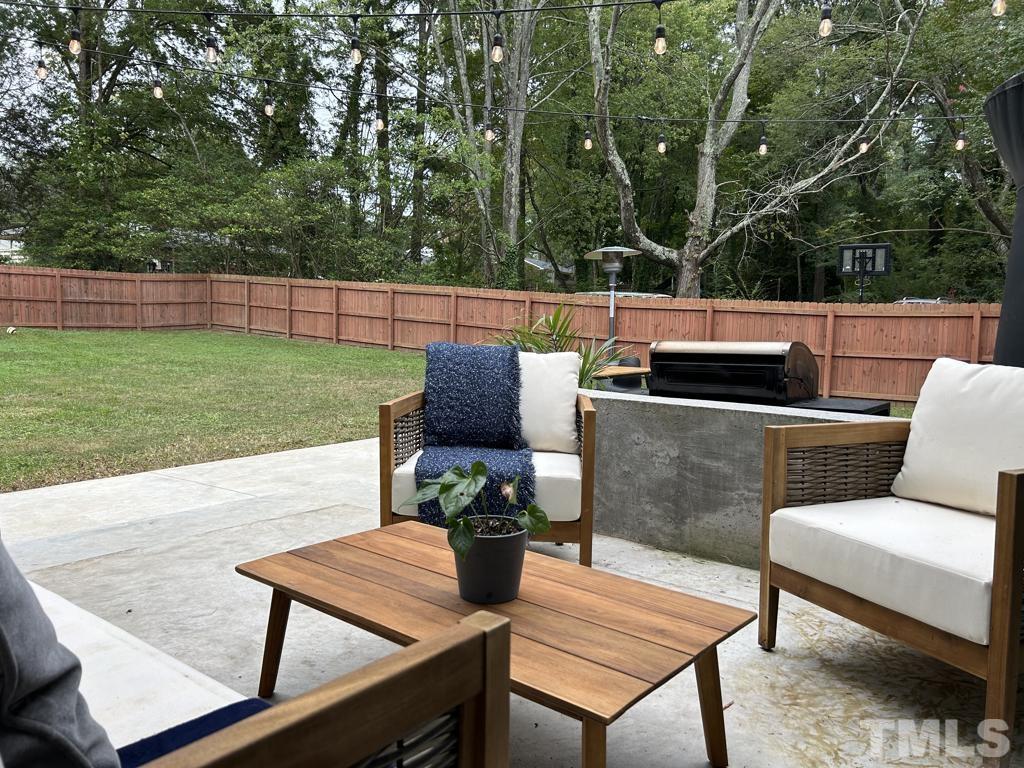 607 Morreene Road Durham, NC 27705 - Photo 46 of 48 a outdoor sitting area with furniture and garden