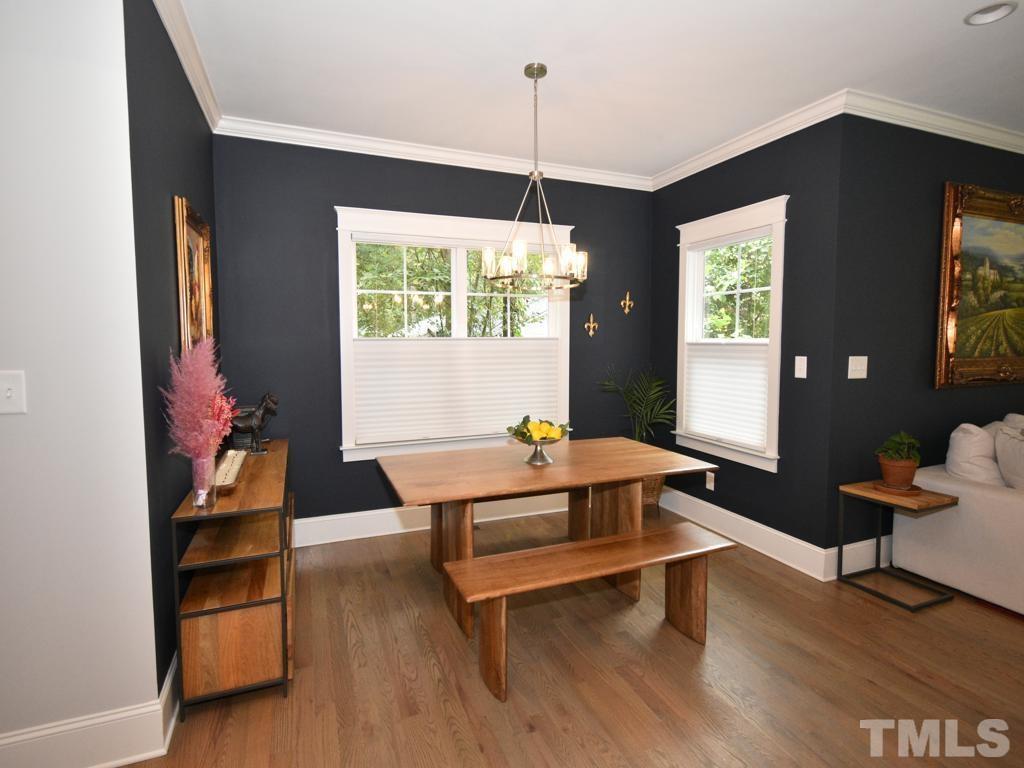 607 Morreene Road Durham, NC 27705 - Photo 10 of 48 a living room with furniture a window and a flat screen tv