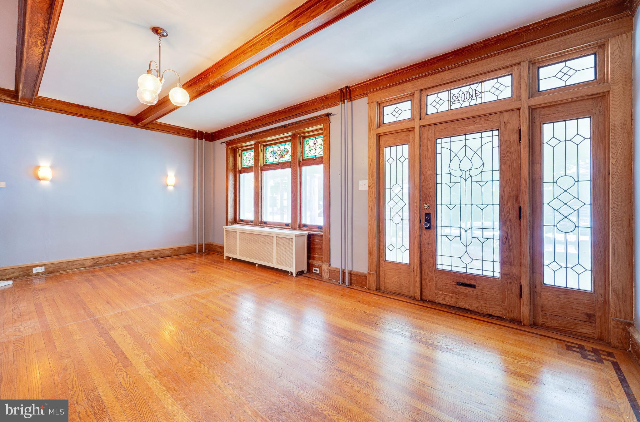 402 Spring Street Reading, PA 19601 - Photo 6 of 37 Living room with stained and leaded glass windows
