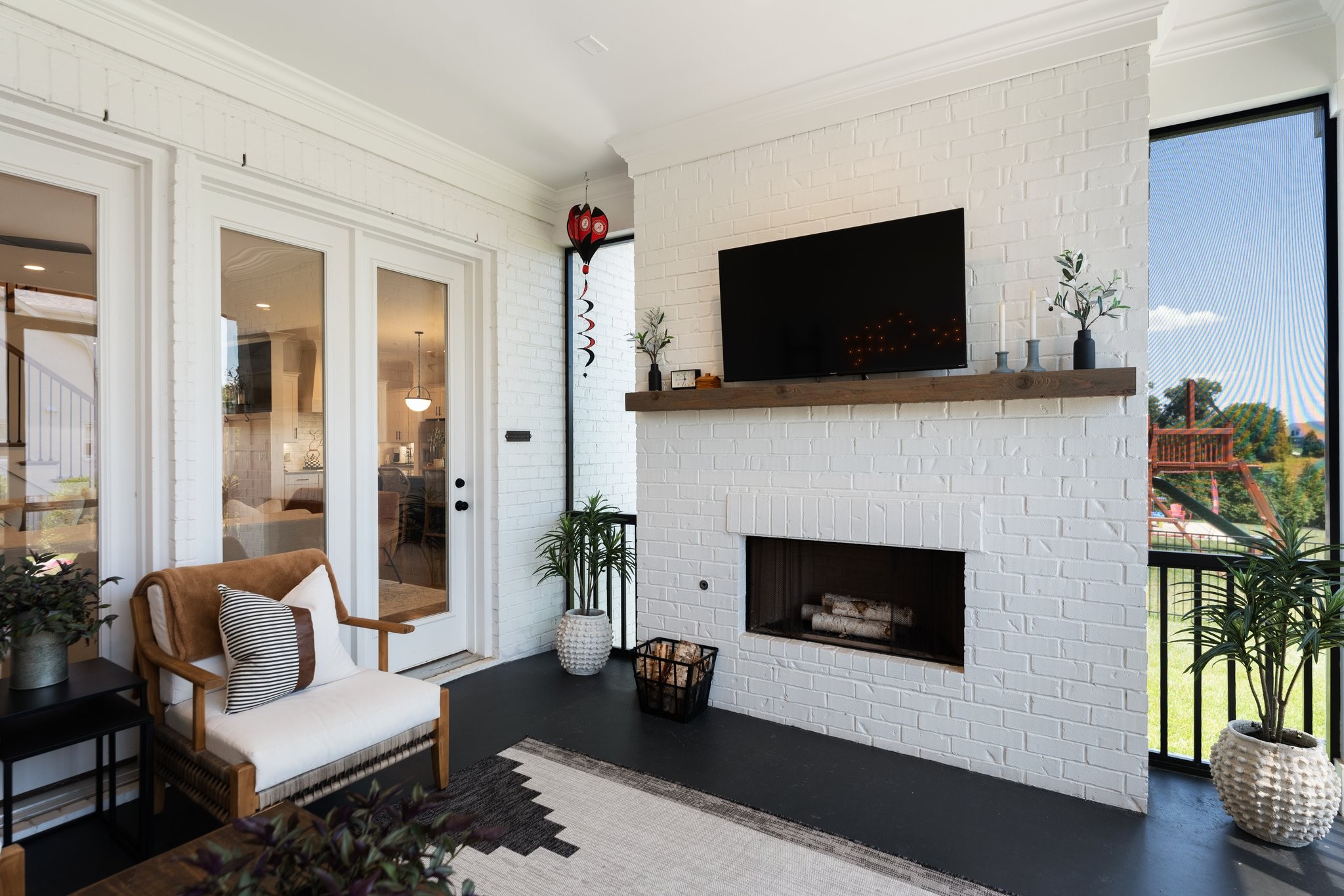 3623 Ronstadt Road Thompson's Station, TN 37179 - Photo 45 of 55 a living room with furniture a flat screen tv and a fireplace
