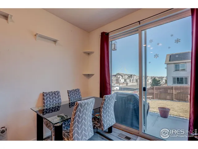 a view of a balcony with furniture