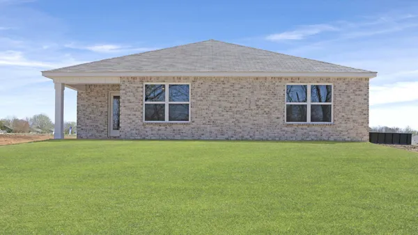 a front view of house with yard