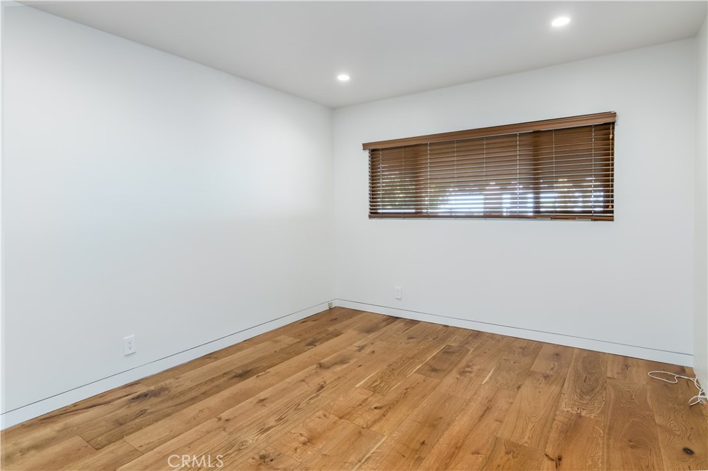 15439 Vose Street Van Nuys, CA 91406 - Photo 11 of 22 a view of empty room with wooden floor