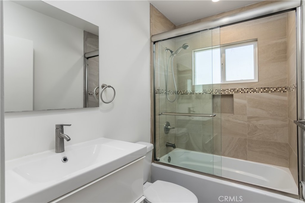 15439 Vose Street Van Nuys, CA 91406 - Photo 14 of 22 a bathroom with a sink toilet and shower