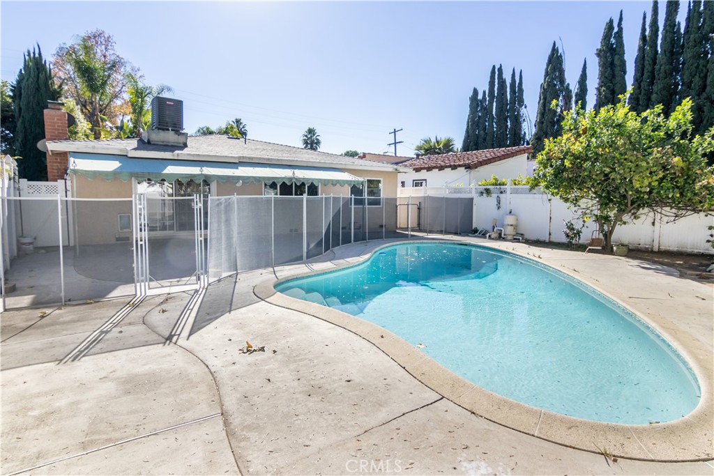 15439 Vose Street Van Nuys, CA 91406 - Photo 22 of 22 a view of a swimming pool with a patio