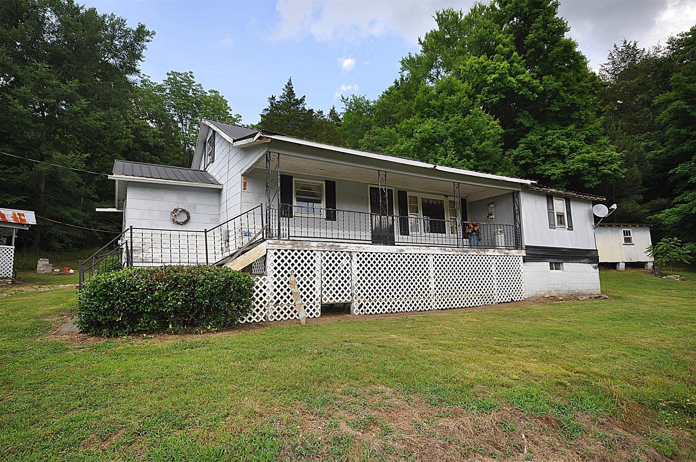 1536 Mack Bean Road Red Boiling Springs, TN 37150 - Photo 2 of 30 a front view of a house with a garden