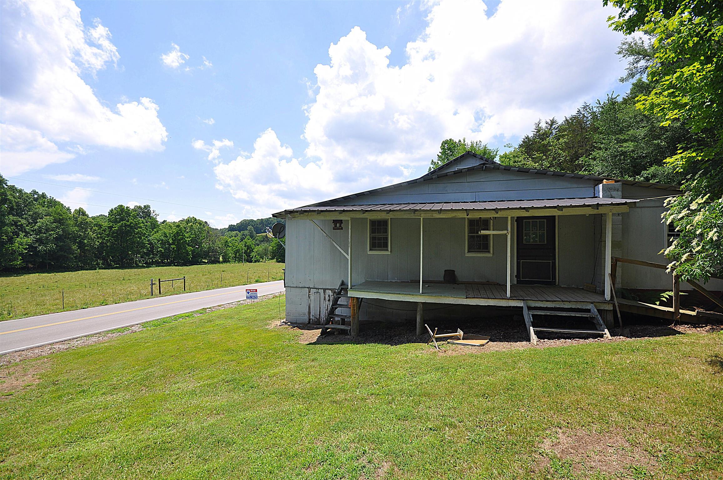 1536 Mack Bean Road Red Boiling Springs, TN 37150 - Photo 19 of 30 a view of a house with a yard