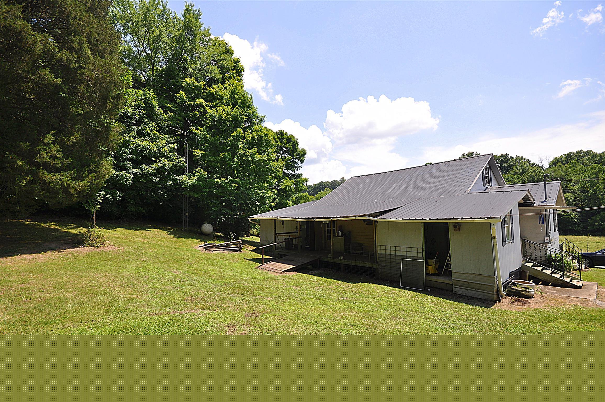 1536 Mack Bean Road Red Boiling Springs, TN 37150 - Photo 21 of 30 a view of a house with yard and sitting area