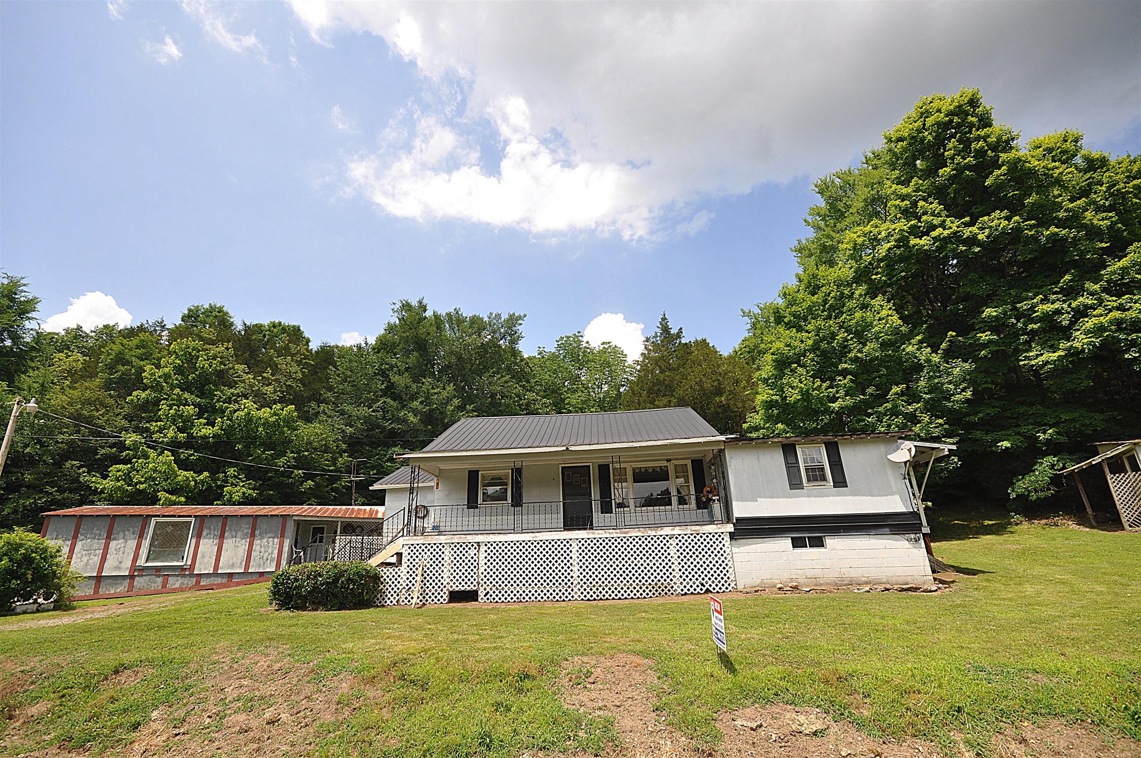 1536 Mack Bean Road Red Boiling Springs, TN 37150 - Photo 24 of 30 a front view of a house with a yard