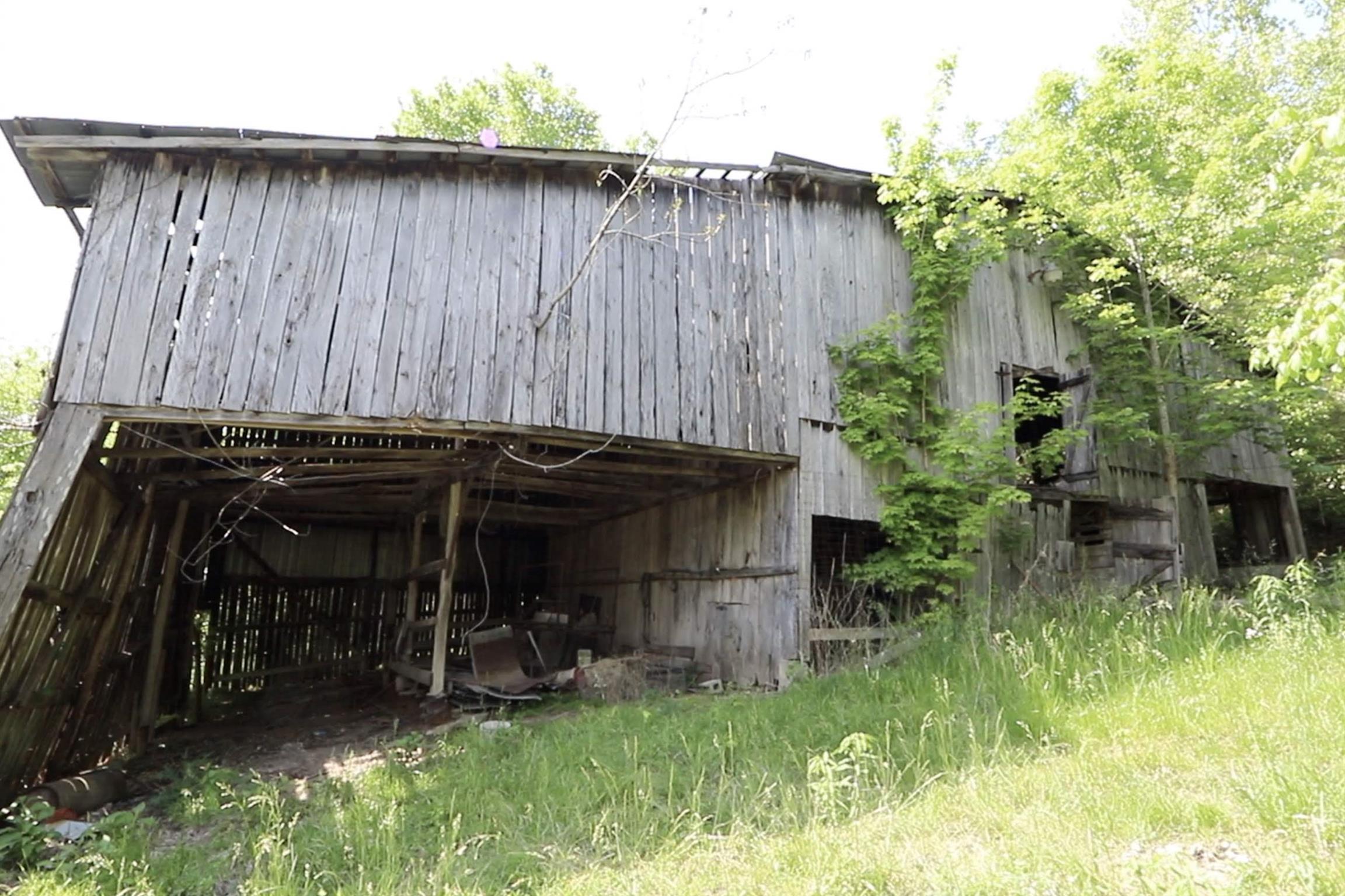 1536 Mack Bean Road Red Boiling Springs, TN 37150 - Photo 27 of 30 a view of a back yard of the house and a chair