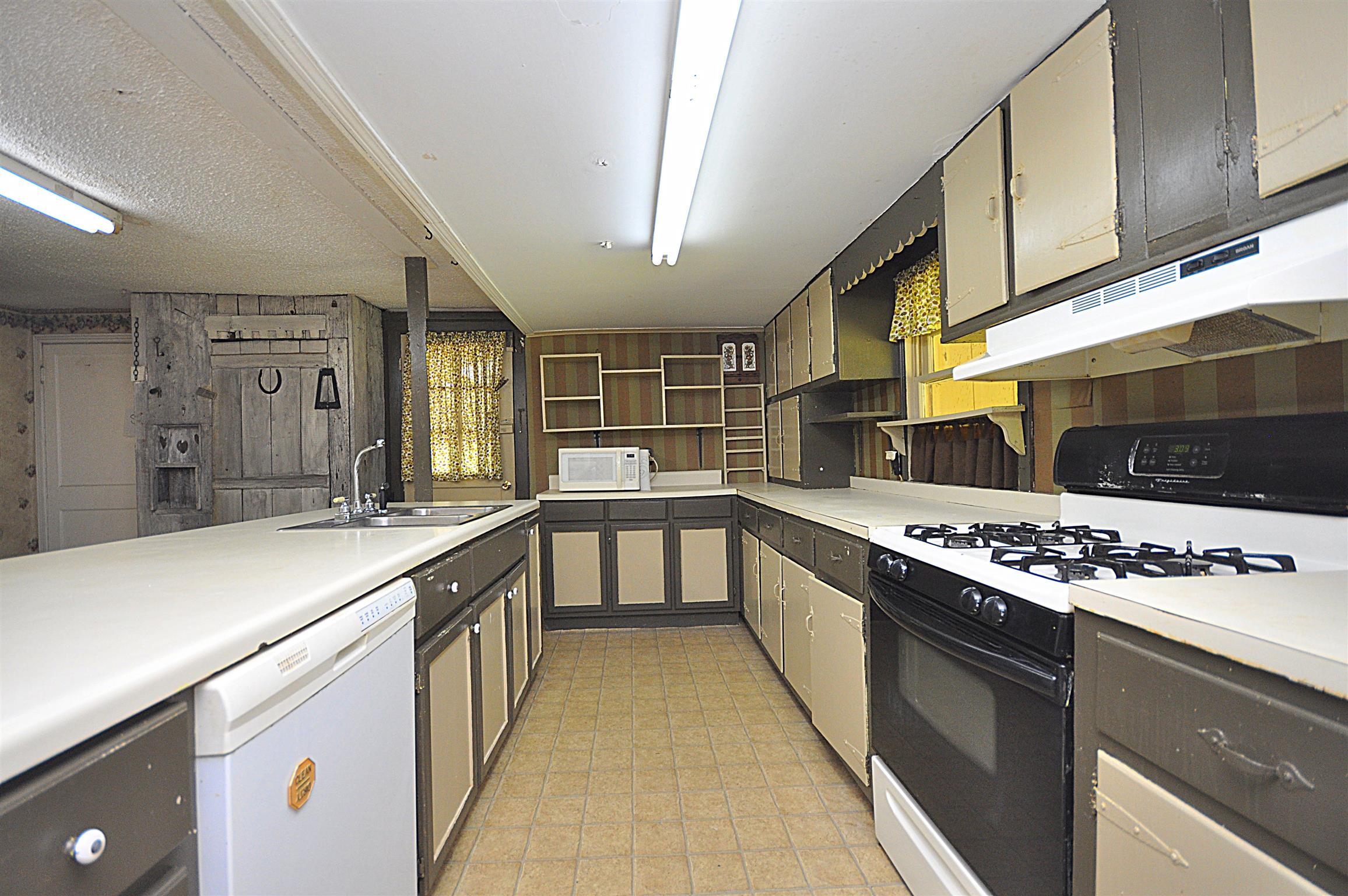 1536 Mack Bean Road Red Boiling Springs, TN 37150 - Photo 6 of 30 a kitchen with stainless steel appliances a sink and stove