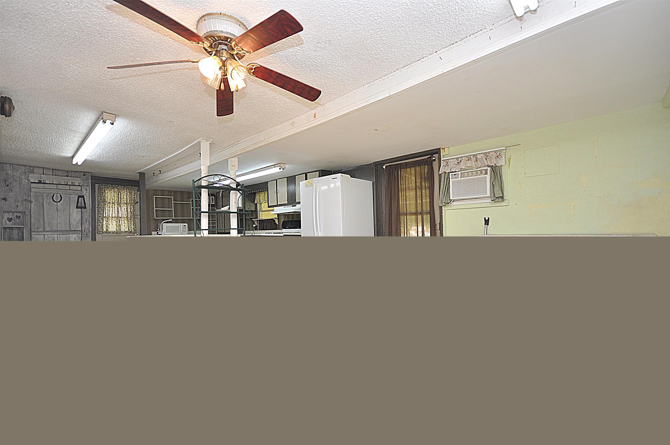 1536 Mack Bean Road Red Boiling Springs, TN 37150 - Photo 7 of 30 a view of a livingroom with a ceiling fan