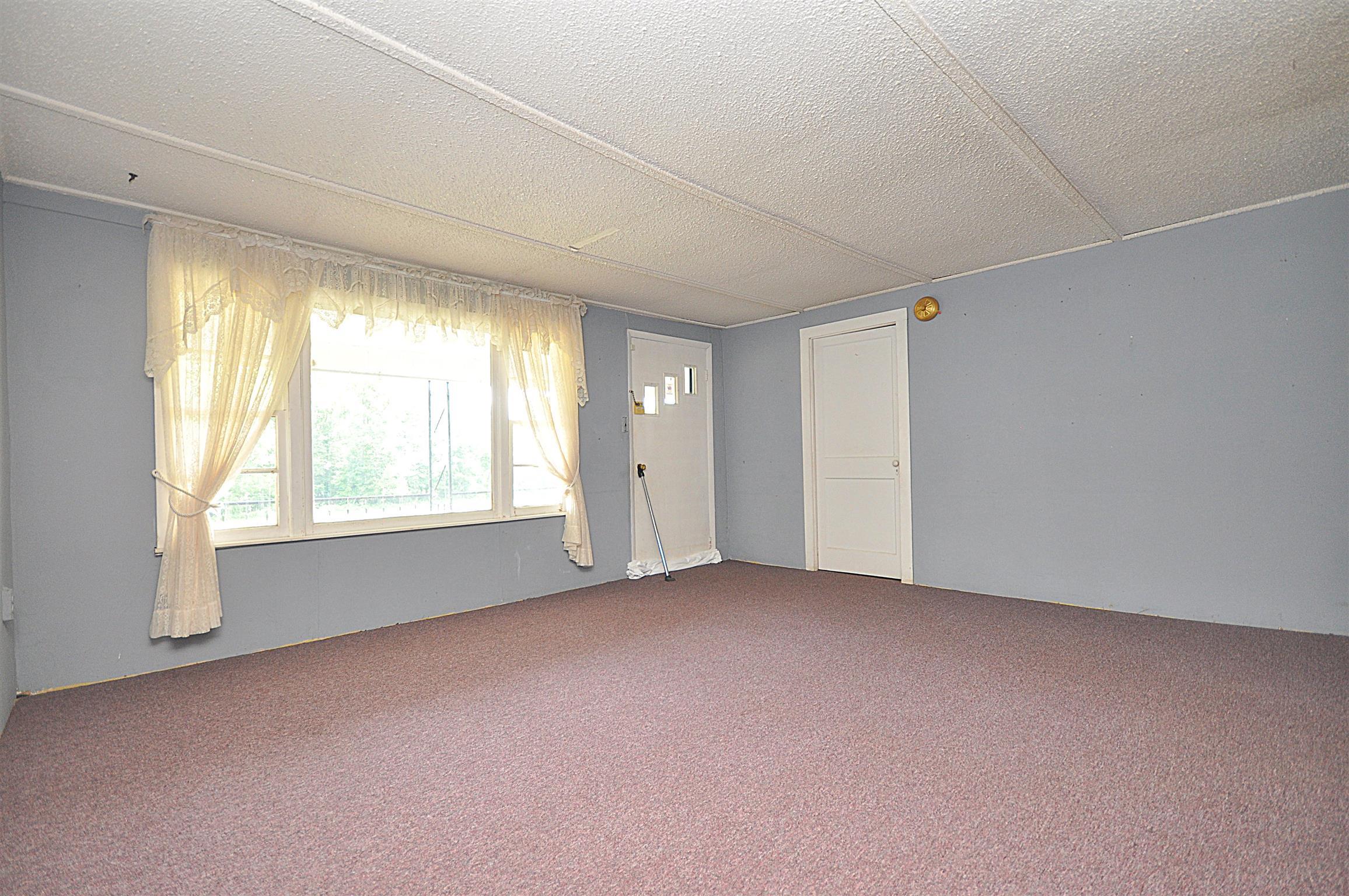 1536 Mack Bean Road Red Boiling Springs, TN 37150 - Photo 8 of 30 an empty room with windows