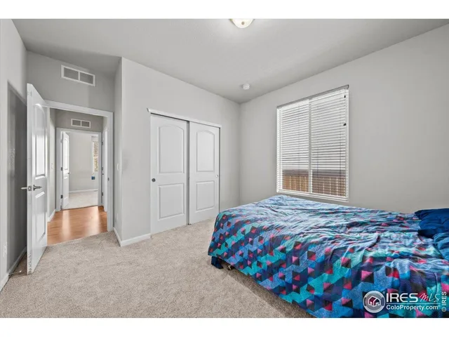 a room with a bed and a window