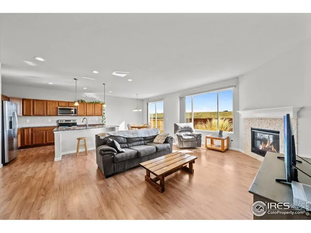 a bedroom with a large bed and a fireplace