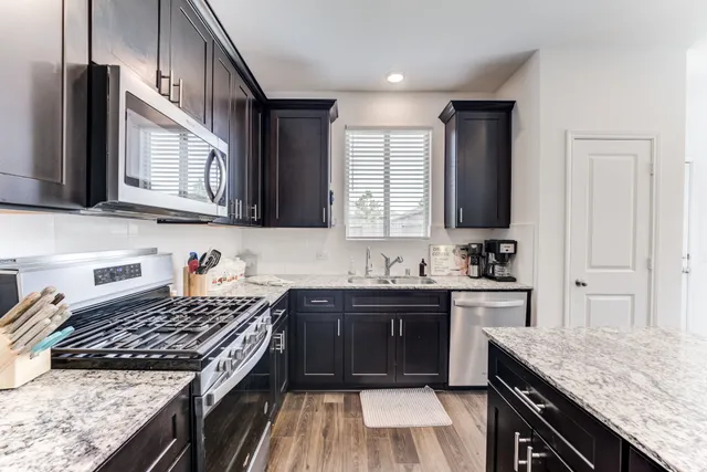 a bathroom with a sink mirror and toilet