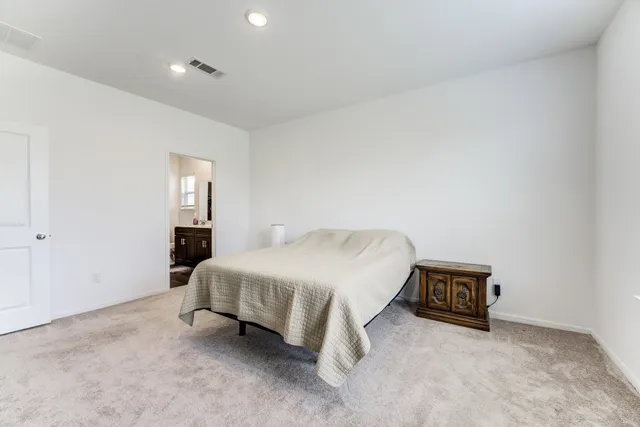 a bedroom with furniture and a window
