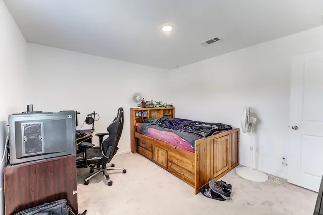 a swimming pool with outdoor seating and yard