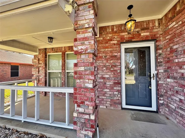 a view of a brick wall with a large window