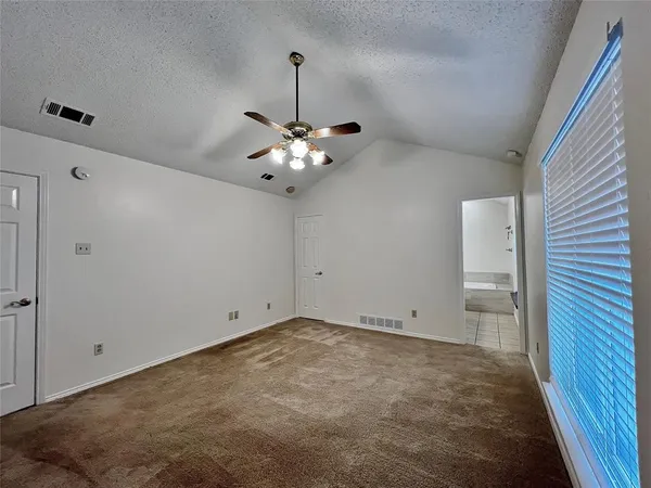 a view of an empty room with a sink