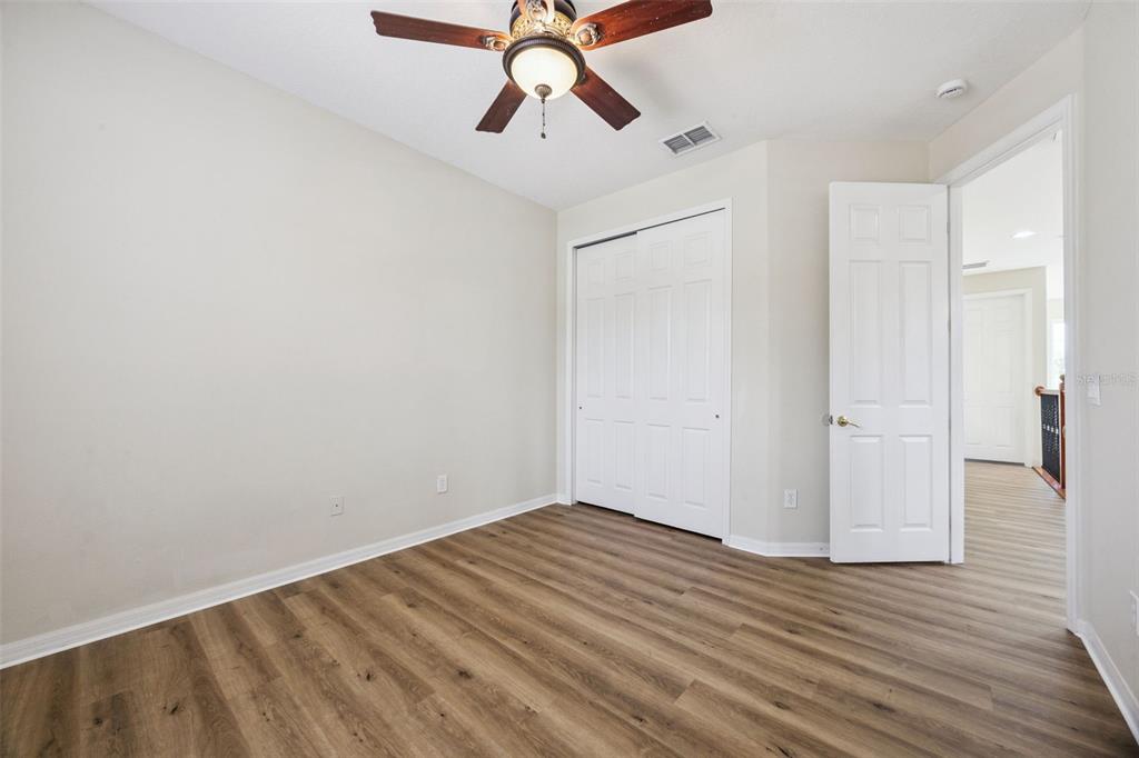 551 Terrace Spring Drive Orlando, FL 32828 - Photo 23 of 41 a view of empty room with wooden floor