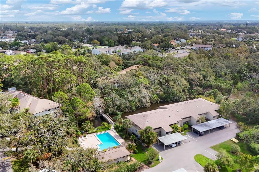 4957 Cross Creek Road, Unit 4957 Sarasota, FL 34231 - Photo 1 of 32 an aerial view of house with yard and mountain view in back