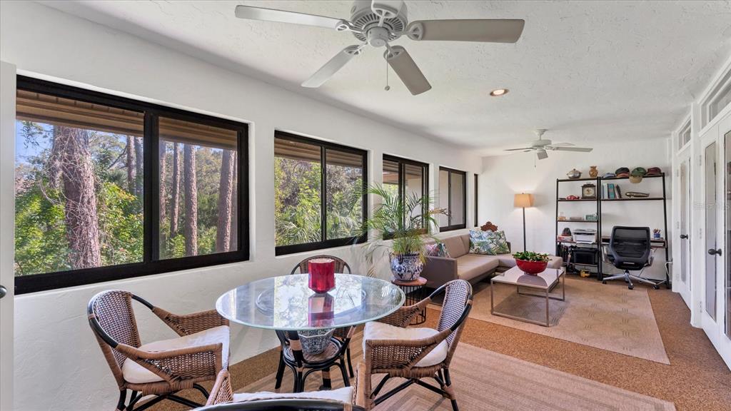 4957 Cross Creek Road, Unit 4957 Sarasota, FL 34231 - Photo 13 of 32 a view of a dining room with furniture window and outside view