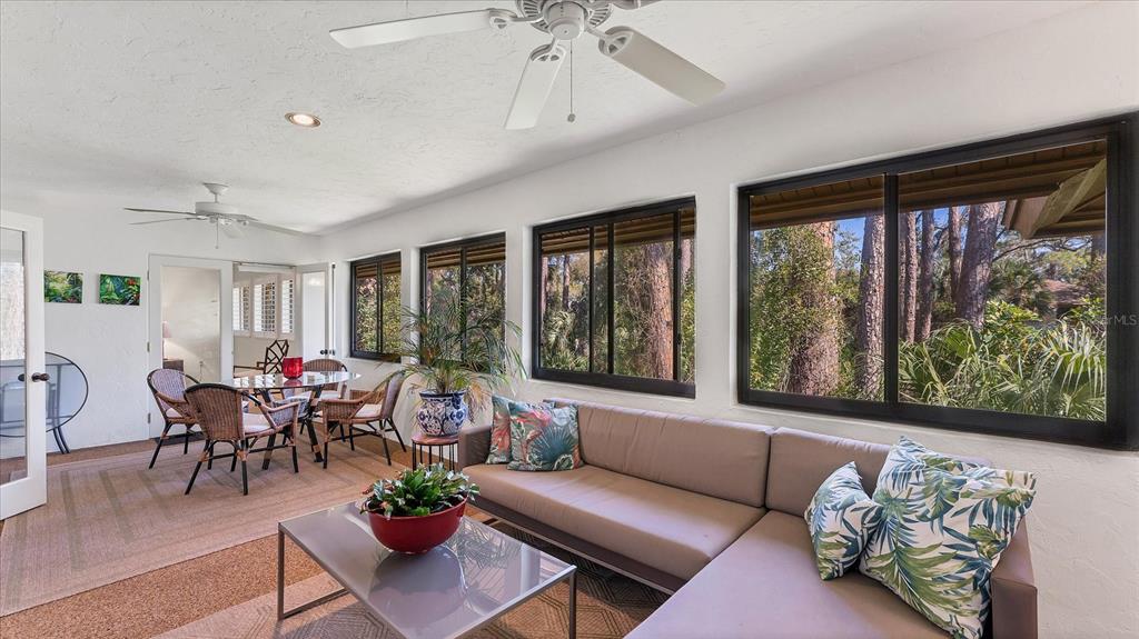 4957 Cross Creek Road, Unit 4957 Sarasota, FL 34231 - Photo 14 of 32 a living room with furniture and a large window