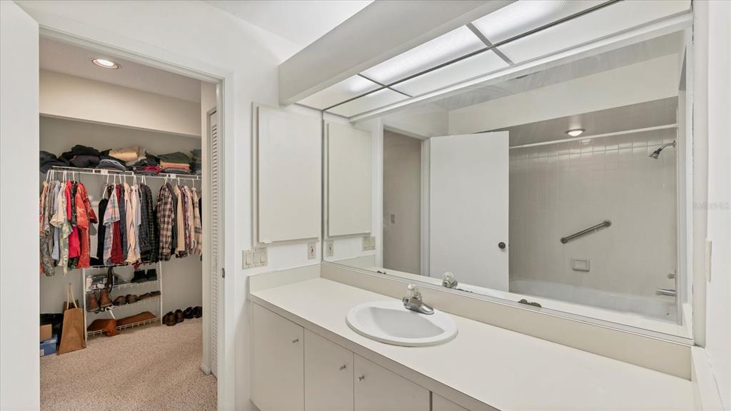 4957 Cross Creek Road, Unit 4957 Sarasota, FL 34231 - Photo 17 of 32 a bathroom with a tub and a sink