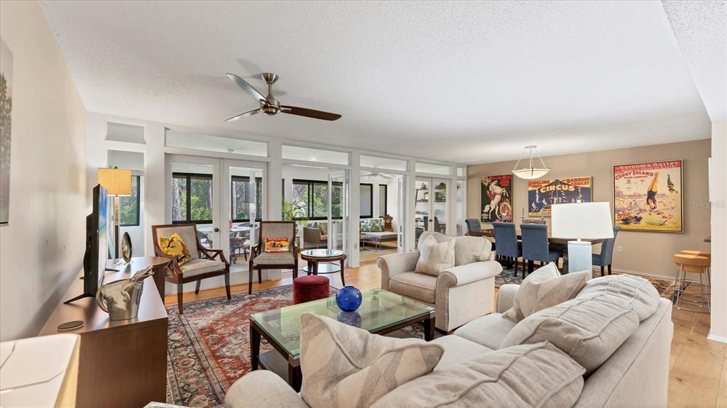 4957 Cross Creek Road, Unit 4957 Sarasota, FL 34231 - Photo 20 of 32 a living room with furniture ceiling fan and a rug