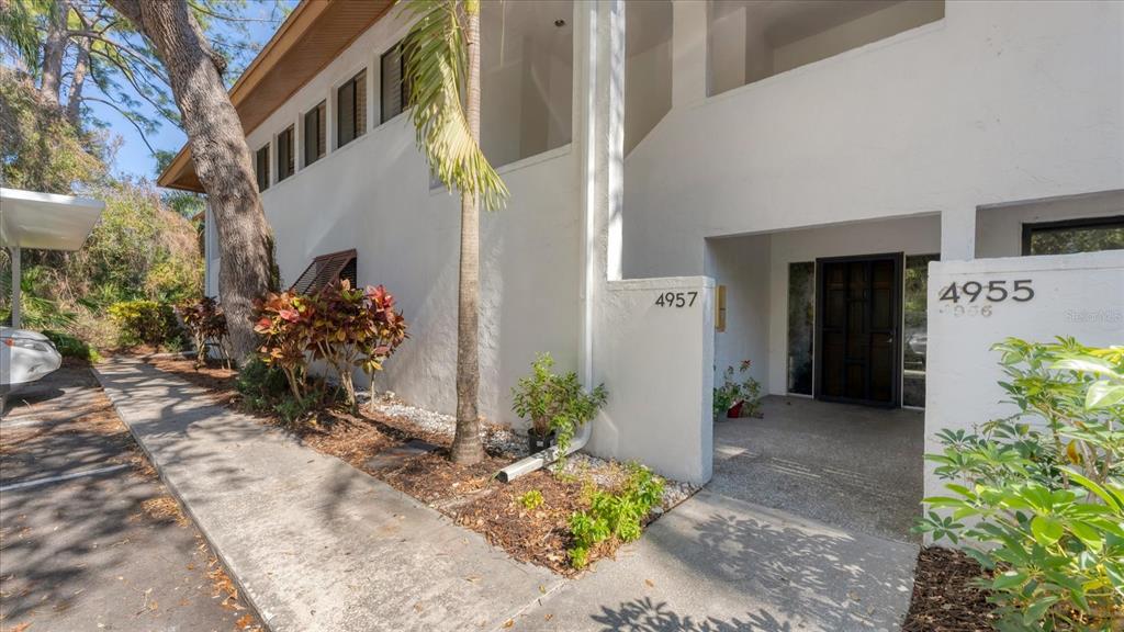4957 Cross Creek Road, Unit 4957 Sarasota, FL 34231 - Photo 2 of 32 a view of a bunch of flowers