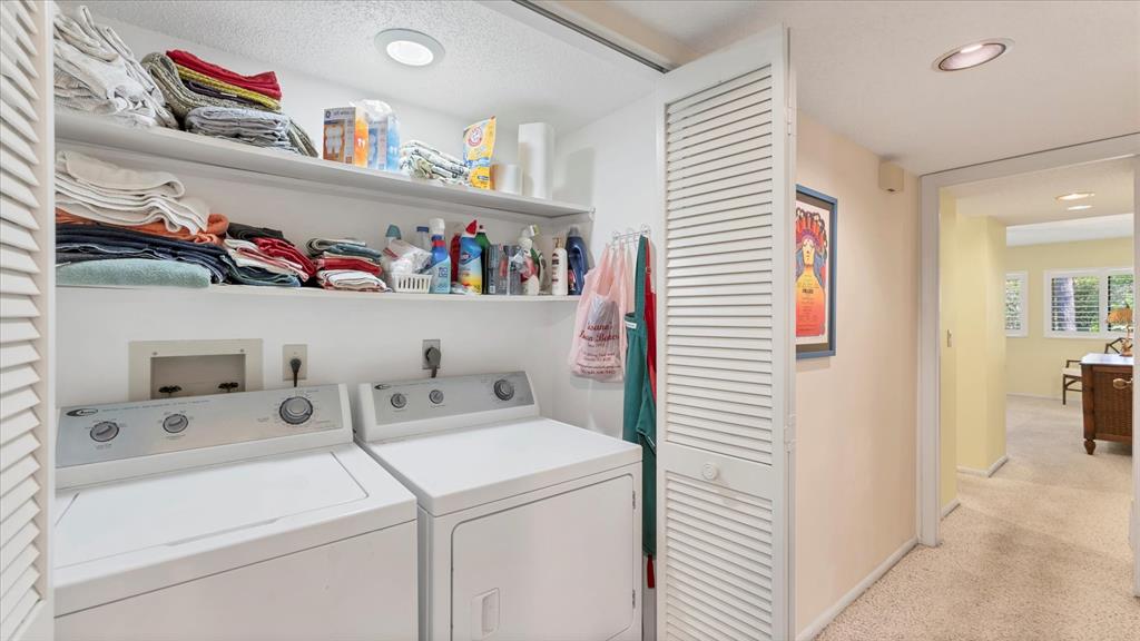 4957 Cross Creek Road, Unit 4957 Sarasota, FL 34231 - Photo 21 of 32 a utility room with dryer and washer