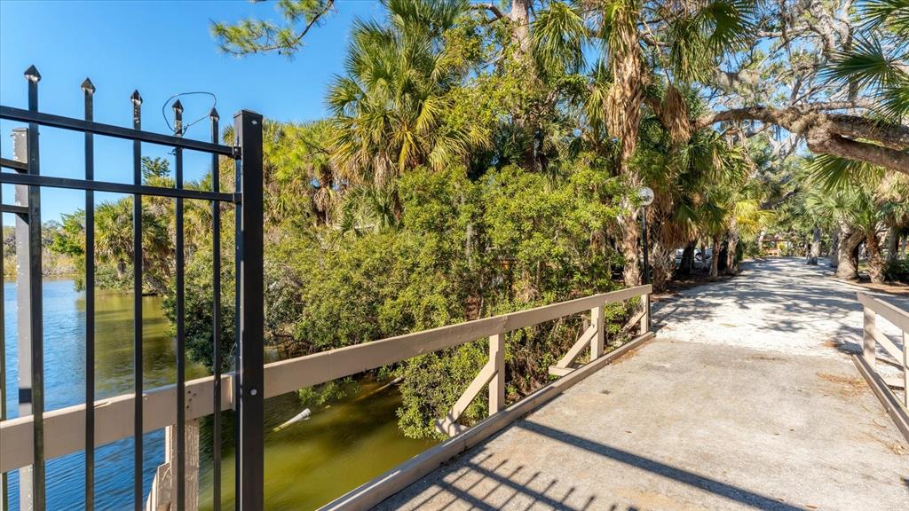 4957 Cross Creek Road, Unit 4957 Sarasota, FL 34231 - Photo 27 of 32 a view of wooden balcony