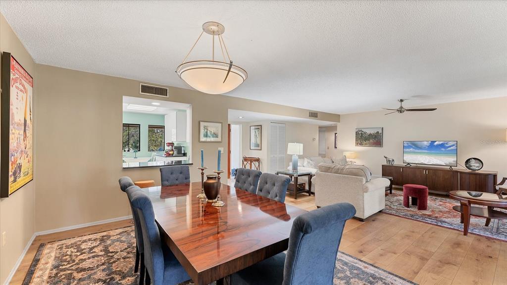 4957 Cross Creek Road, Unit 4957 Sarasota, FL 34231 - Photo 5 of 32 a view of a dining room with furniture