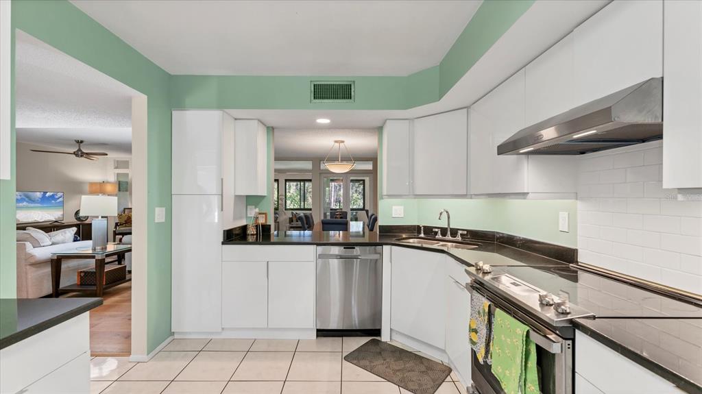 4957 Cross Creek Road, Unit 4957 Sarasota, FL 34231 - Photo 10 of 32 a kitchen with a sink and cabinets