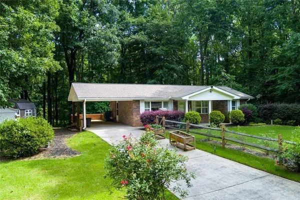 a view of a house with a yard porch and sitting area
