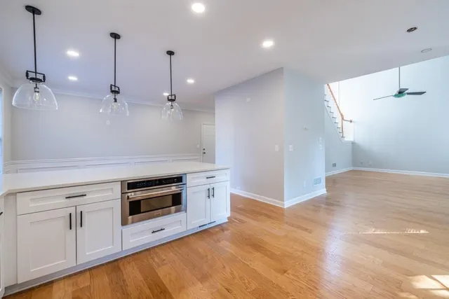 a view of staircase with wooden floor and a window