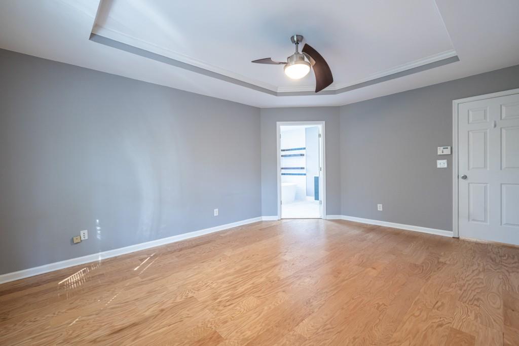 1759 Regency Park Walk Atlanta, GA 30341 - Photo 23 of 61 a view of an empty room with a window and wooden floor