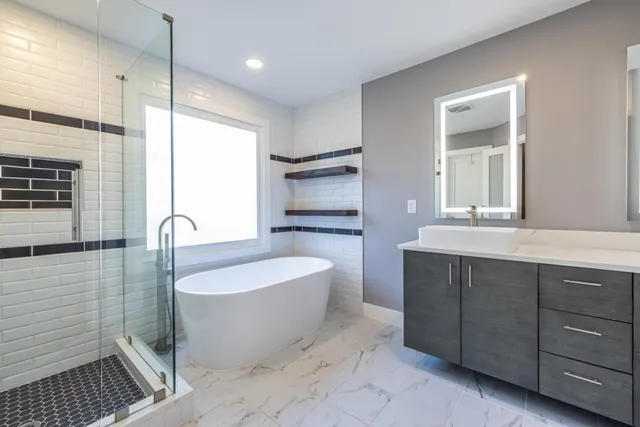 a bathroom with a bathtub shower sink and toilet