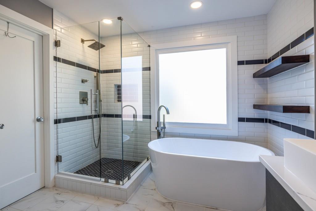 1759 Regency Park Walk Atlanta, GA 30341 - Photo 26 of 61 a bathroom with a bathtub and a shower