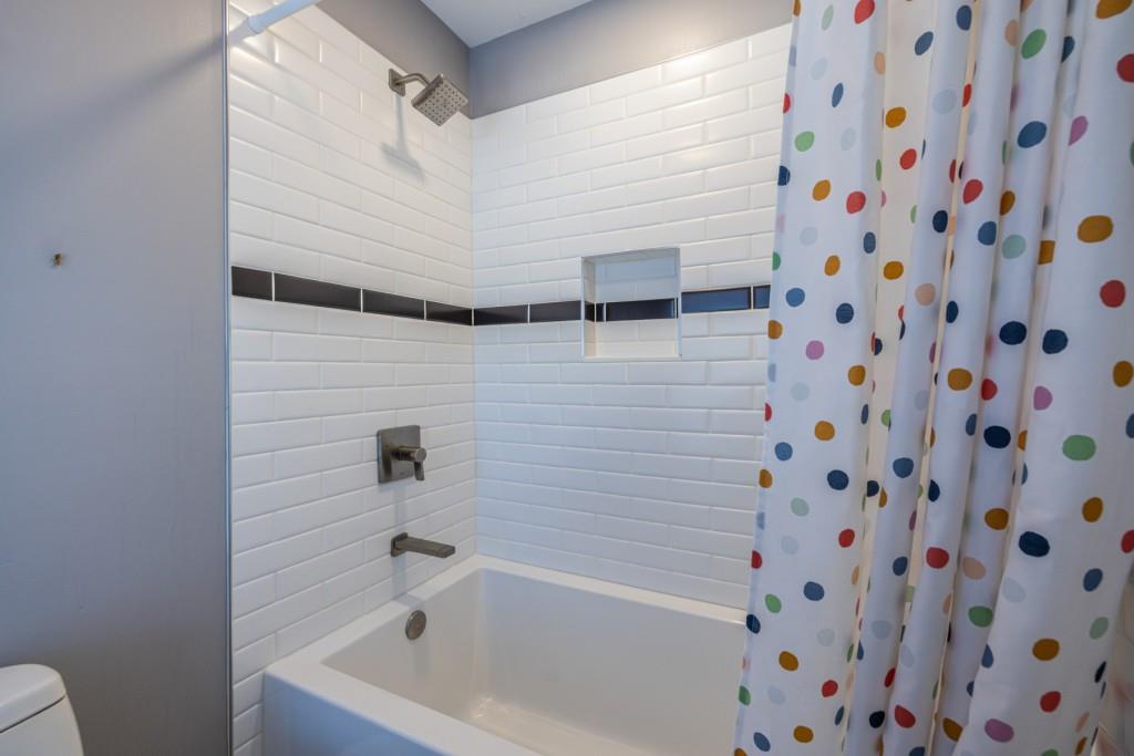 1759 Regency Park Walk Atlanta, GA 30341 - Photo 35 of 61 a bathroom with a bathtub and shower