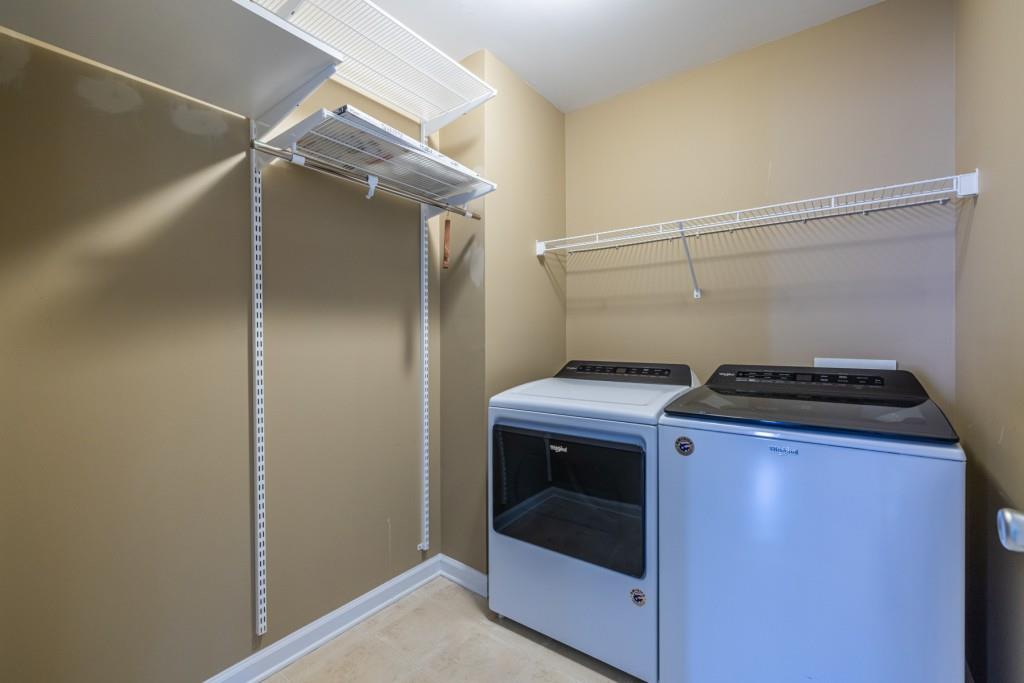 1759 Regency Park Walk Atlanta, GA 30341 - Photo 36 of 61 a utility room with dryer and washer