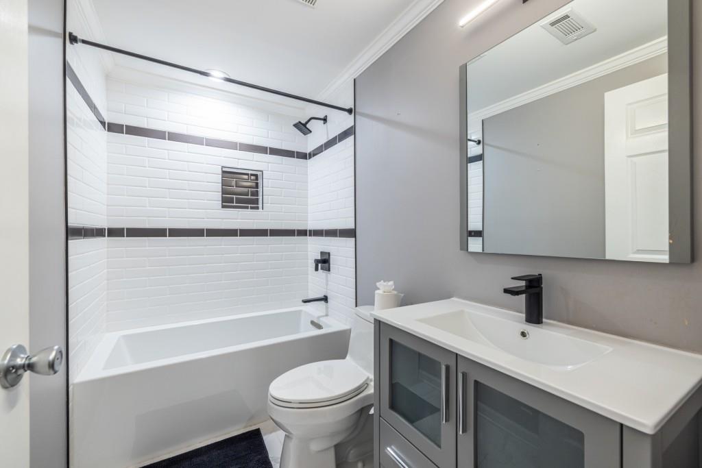 1759 Regency Park Walk Atlanta, GA 30341 - Photo 46 of 61 a bathroom with a sink a toilet and shower