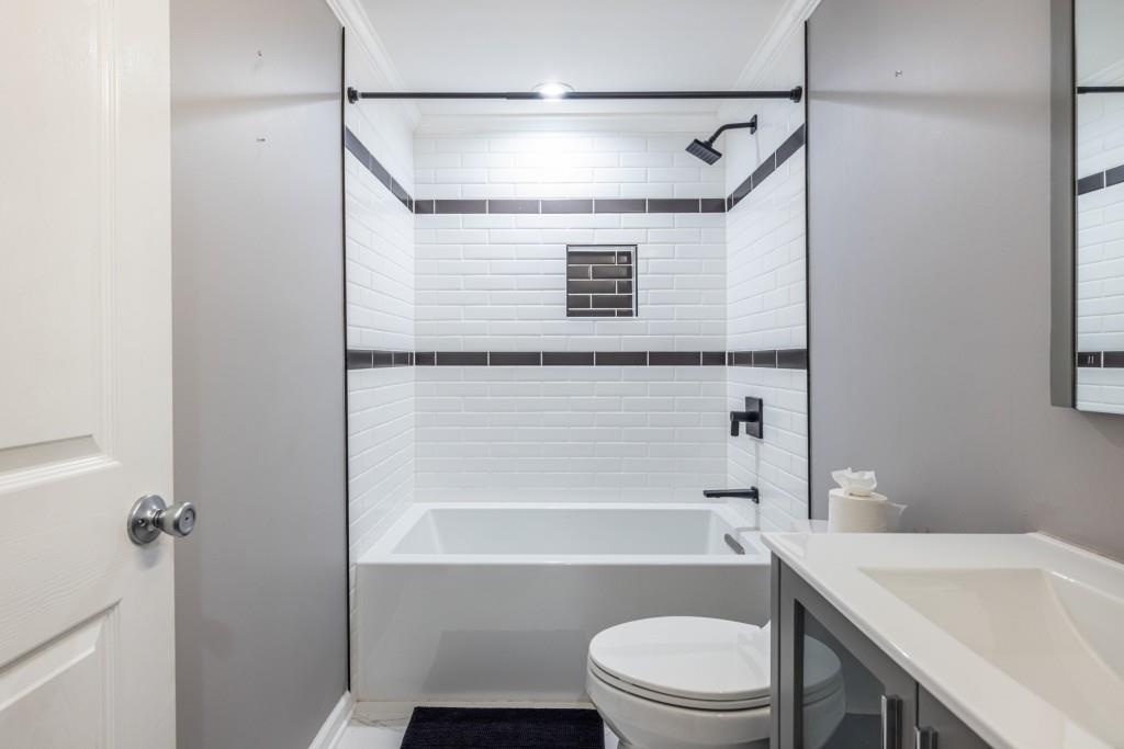 1759 Regency Park Walk Atlanta, GA 30341 - Photo 47 of 61 a bathroom with a toilet and a bathtub