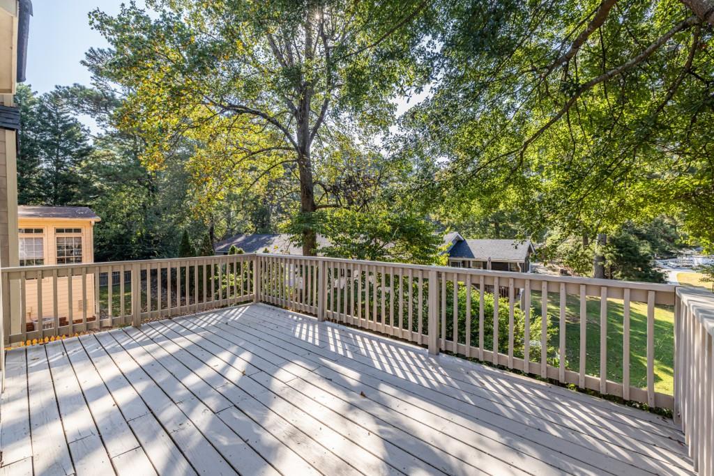 1759 Regency Park Walk Atlanta, GA 30341 - Photo 58 of 61 a view of balcony with wooden floor and fence