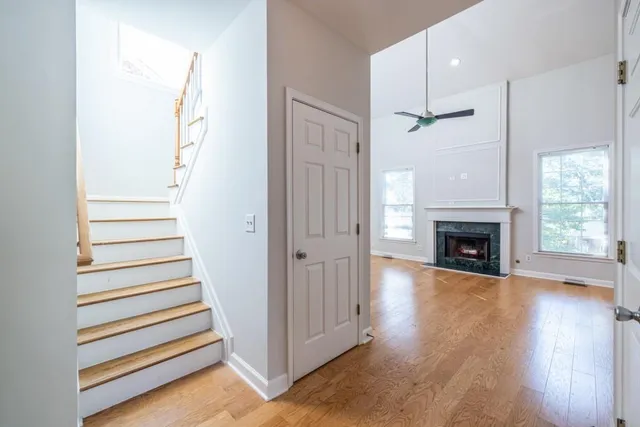 a view of an entryway with wooden floor