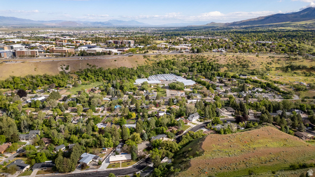 1365 Sumac Drive Logan, UT 84321 - Photo 50 of 66 Expansive aerial perspective showcasing a verdant residential area with mature tree coverage